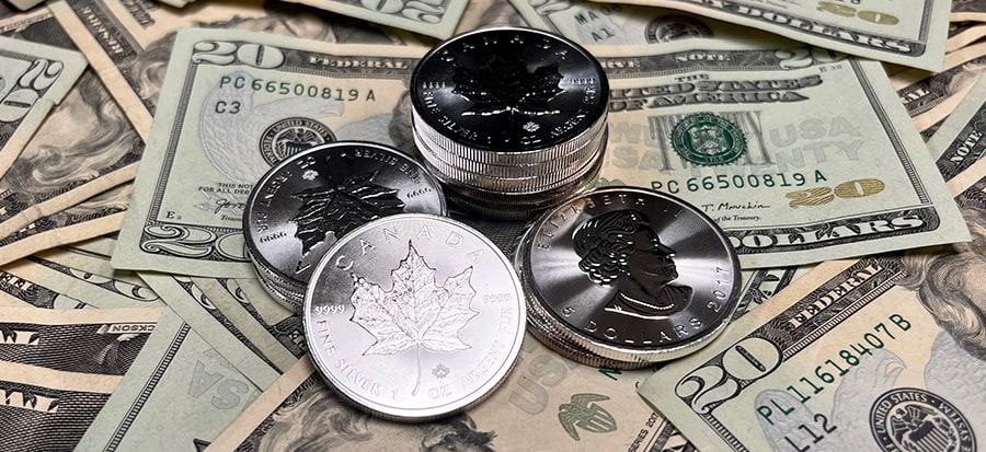 silver maple leaf coins with cash