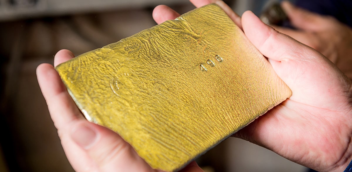 gold ingot in hands