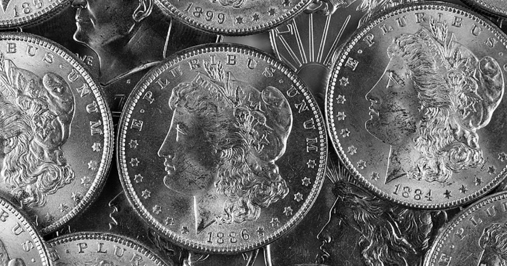 morgan dollar eagles and dimes silver coin pile